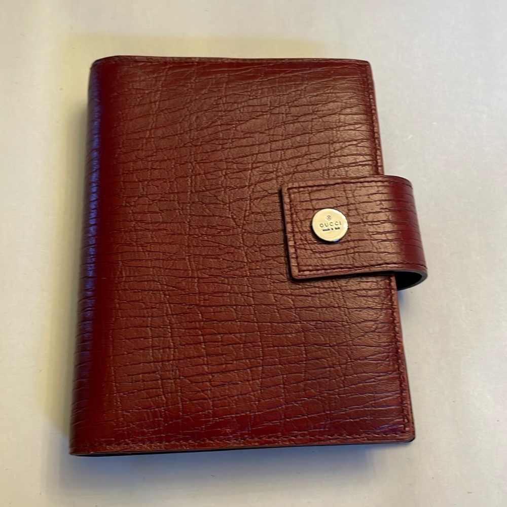 Burgundy Gucci planner with silver mens/women’s paper from 2003 Italy wallet